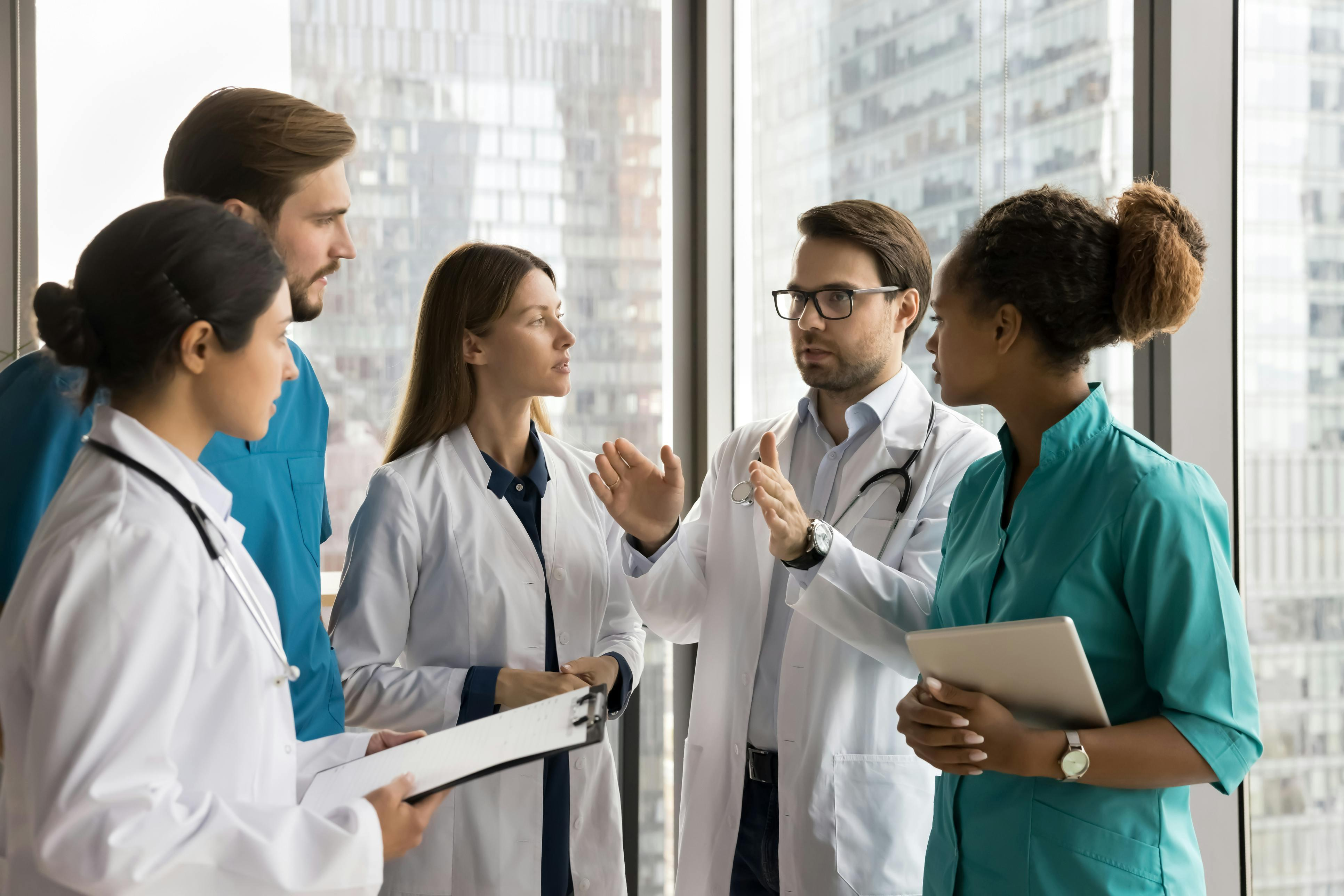 Healthcare professionals attending a morning clinical briefing