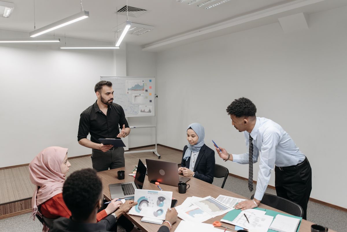 A team gathered around a table for a structured operations planning discussion